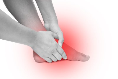 hands on foot in pain