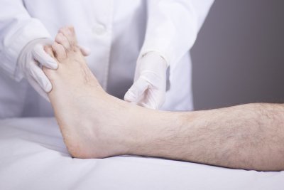 A person inspecting foot