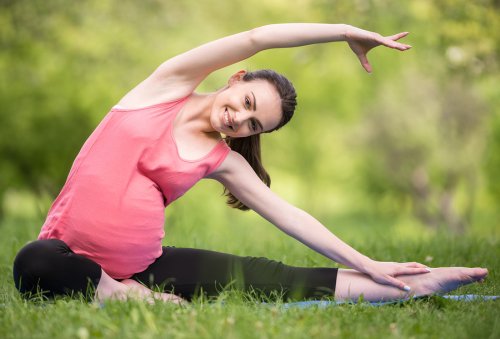 A pregnant women practicing yoga